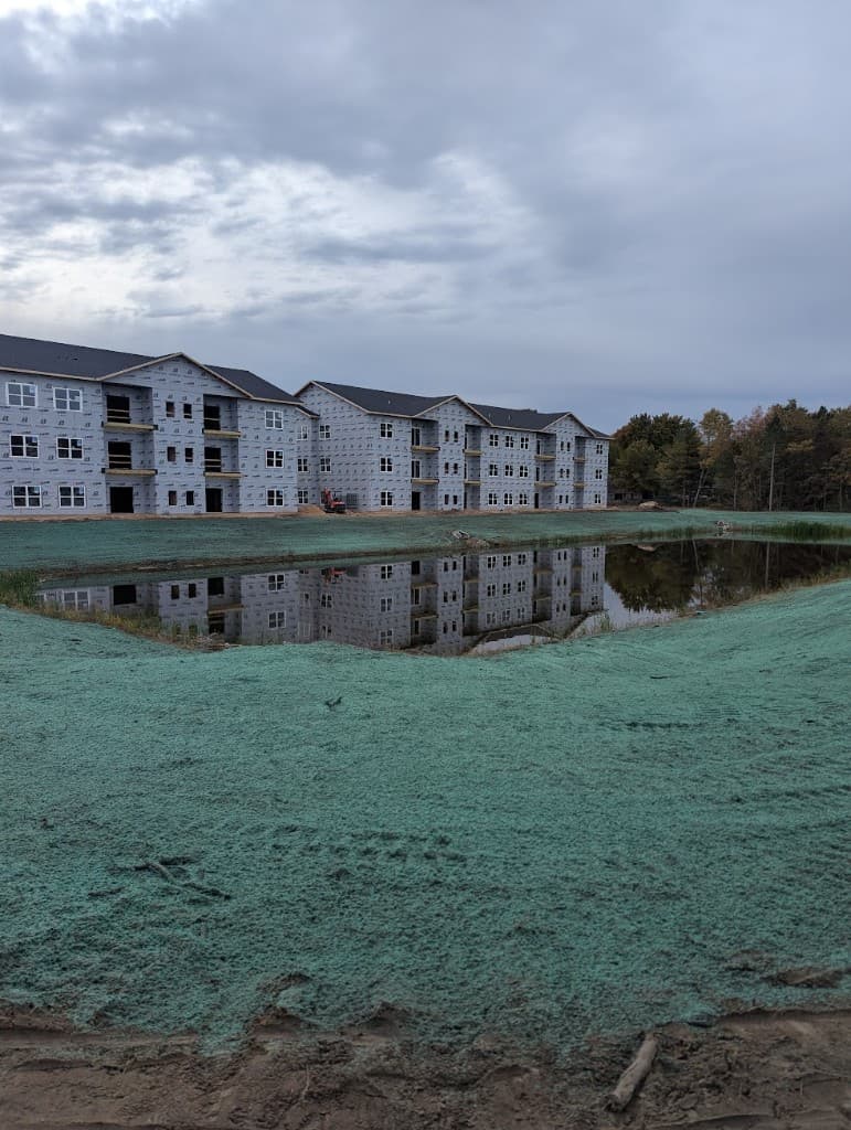 Hydromulching around a retention pond at a lakefront development in West Michigan