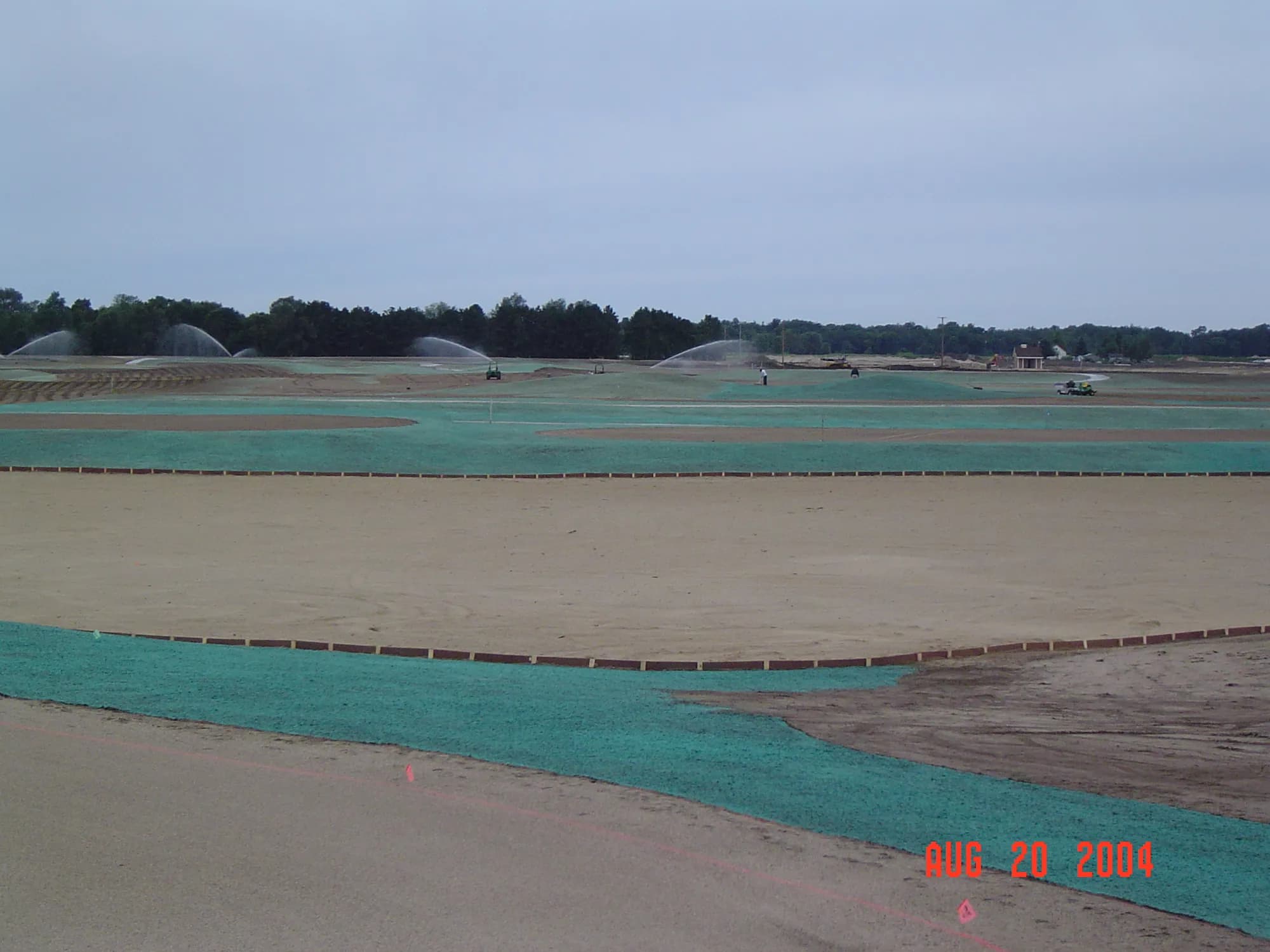 Hydroseeder applying slurry on a large commercial property in West Michigan